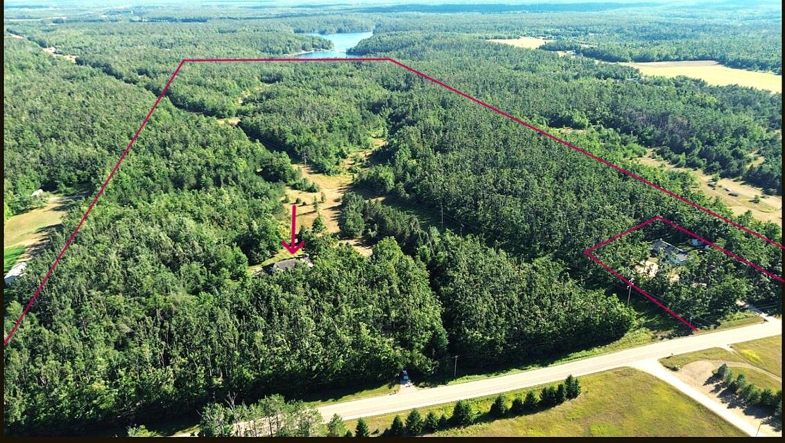 Aerial view of the wooded acreage and surrounding countryside