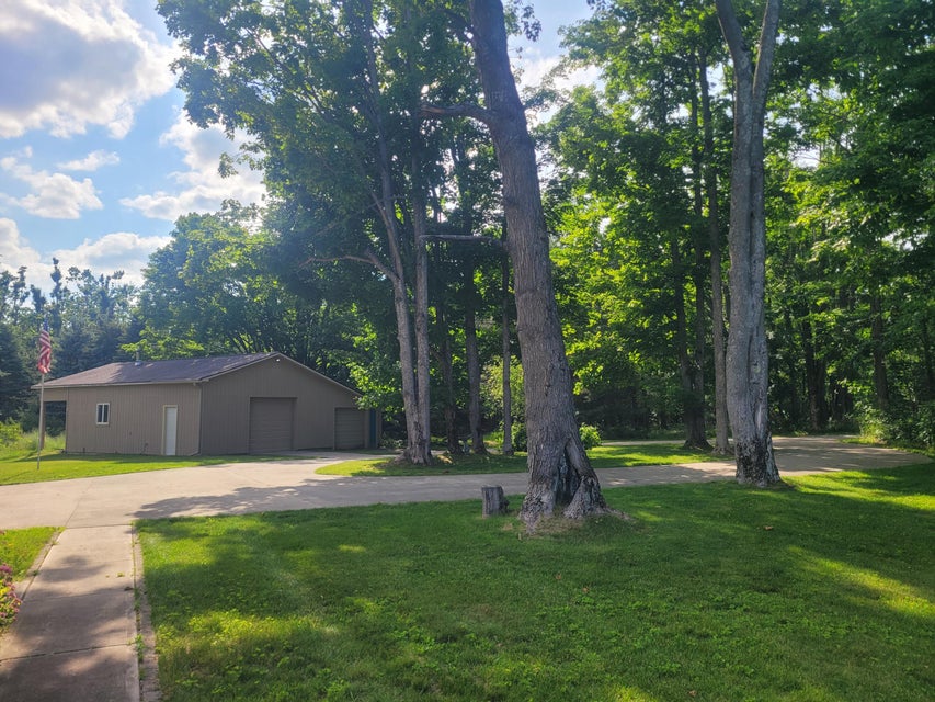 Pole barn and mature trees